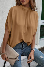 Elegant Trendsi tie-back half-sleeve blouse with side slit, showcasing a stylish and flowy top for women.
