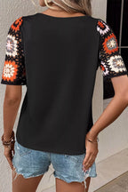 Geometric print round neck short sleeve blouse from Trendsi, featuring a stylish design and comfortable fit.