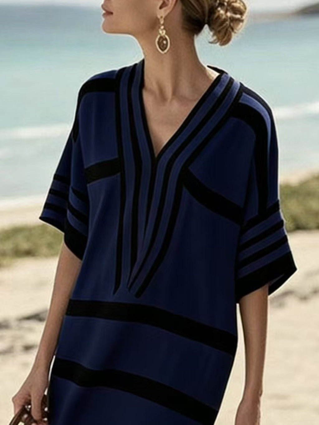 Plus size women's striped half-sleeve midi dress by Trendsi, featuring casual chic style and comfortable everyday wear.
