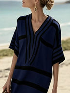 Plus size women's striped half-sleeve midi dress by Trendsi, featuring casual chic style and comfortable everyday wear.