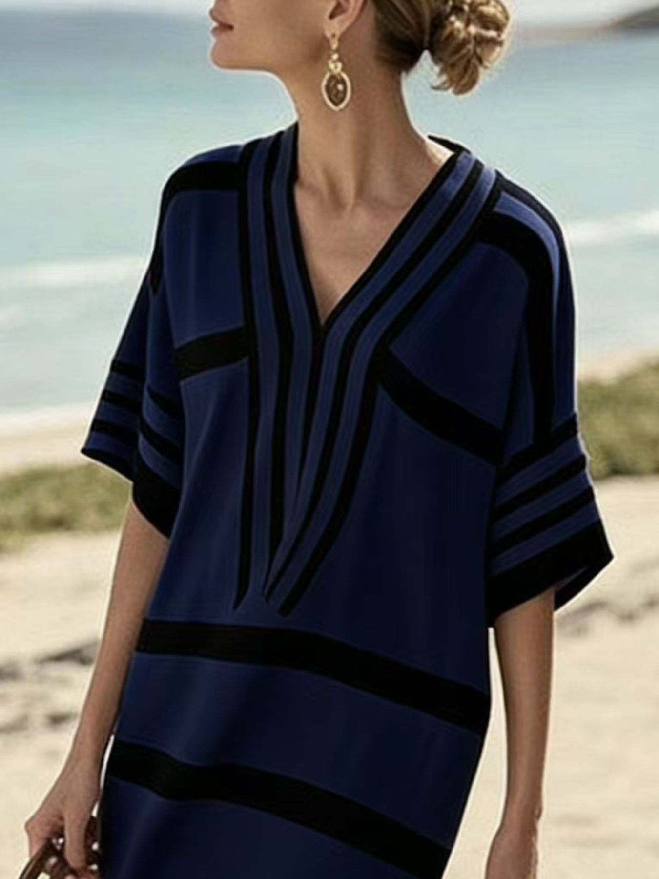 Plus size women's striped half-sleeve midi dress by Trendsi, featuring casual chic style and comfortable everyday wear.