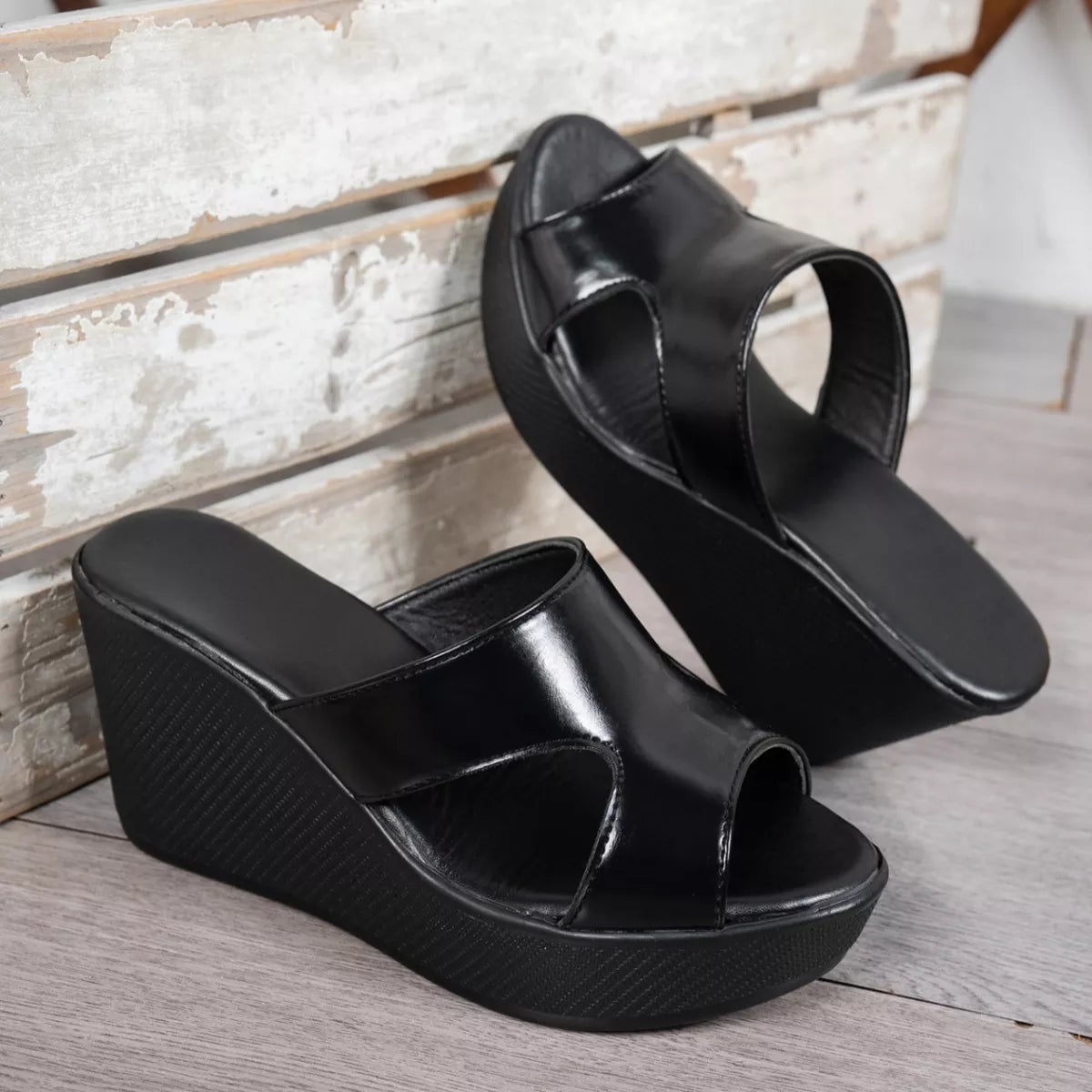 Open toe wedge sandals by Plush Fashion Hub featuring a stylish design with a comfortable platform heel and adjustable ankle strap.