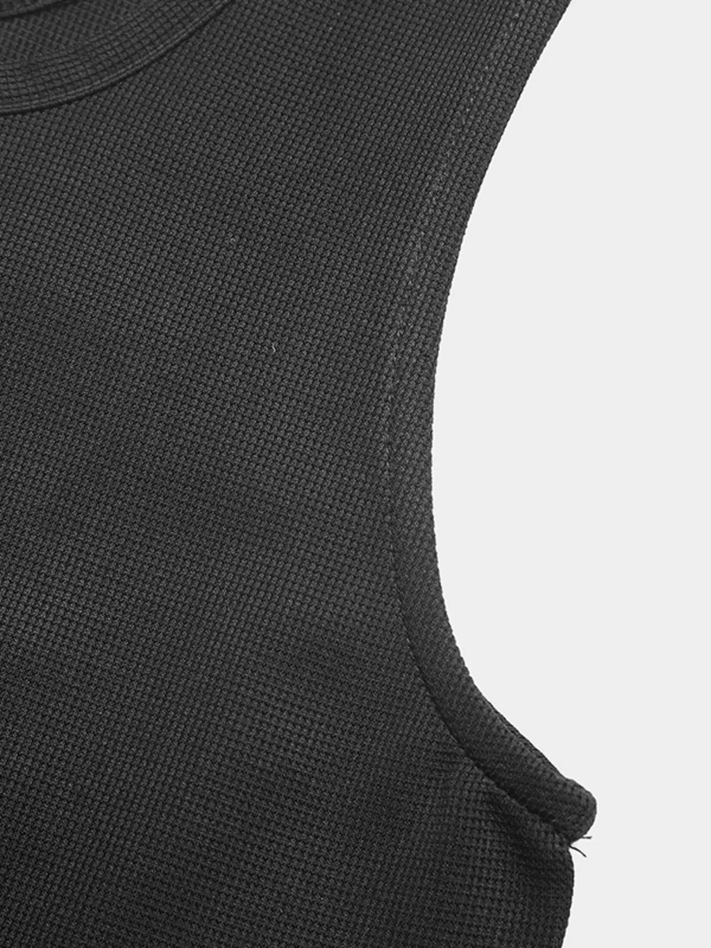 Sleeveless button-front wide-leg jumpsuit by Trendsi, showcasing a comfortable and chic romper style with flattering fit and flowing silhouette.