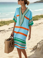 Plus size women's striped half-sleeve midi dress by Trendsi, casual chic everyday wear, featuring a stylish striped pattern and comfortable fit.