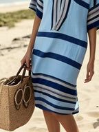 Plus size women's striped half-sleeve midi dress by Trendsi, casual chic everyday wear, featuring a relaxed fit and stylish pattern.