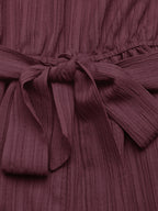 Elegant one-shoulder tie-waist romper in premium polyester, perfect for summer, shown in a stylish jumpsuit design.