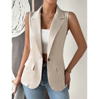 A beige sleeveless tailored vest blazer with notch lapels, a single button closure, and two flap pockets.