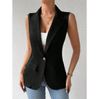 A sleeveless black blazer vest featuring a notched collar, a single button closure, and two front flap pockets.