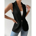 Sleeveless black blazer vest with notched lapels, single-button closure, and two flap pockets.