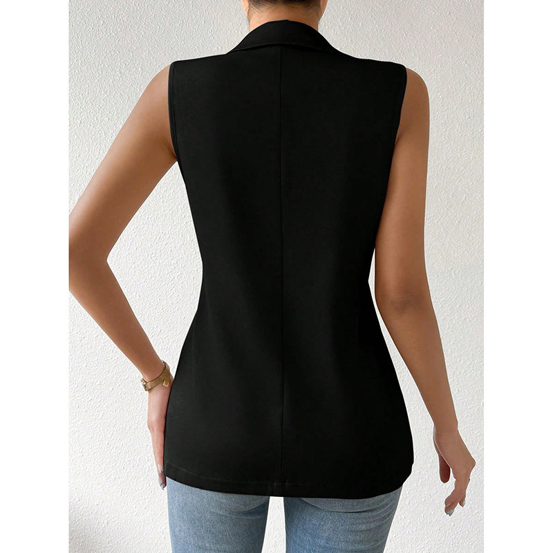 Back view of a woman wearing a sleeveless black tailored vest with a collared neckline, paired with blue jeans.