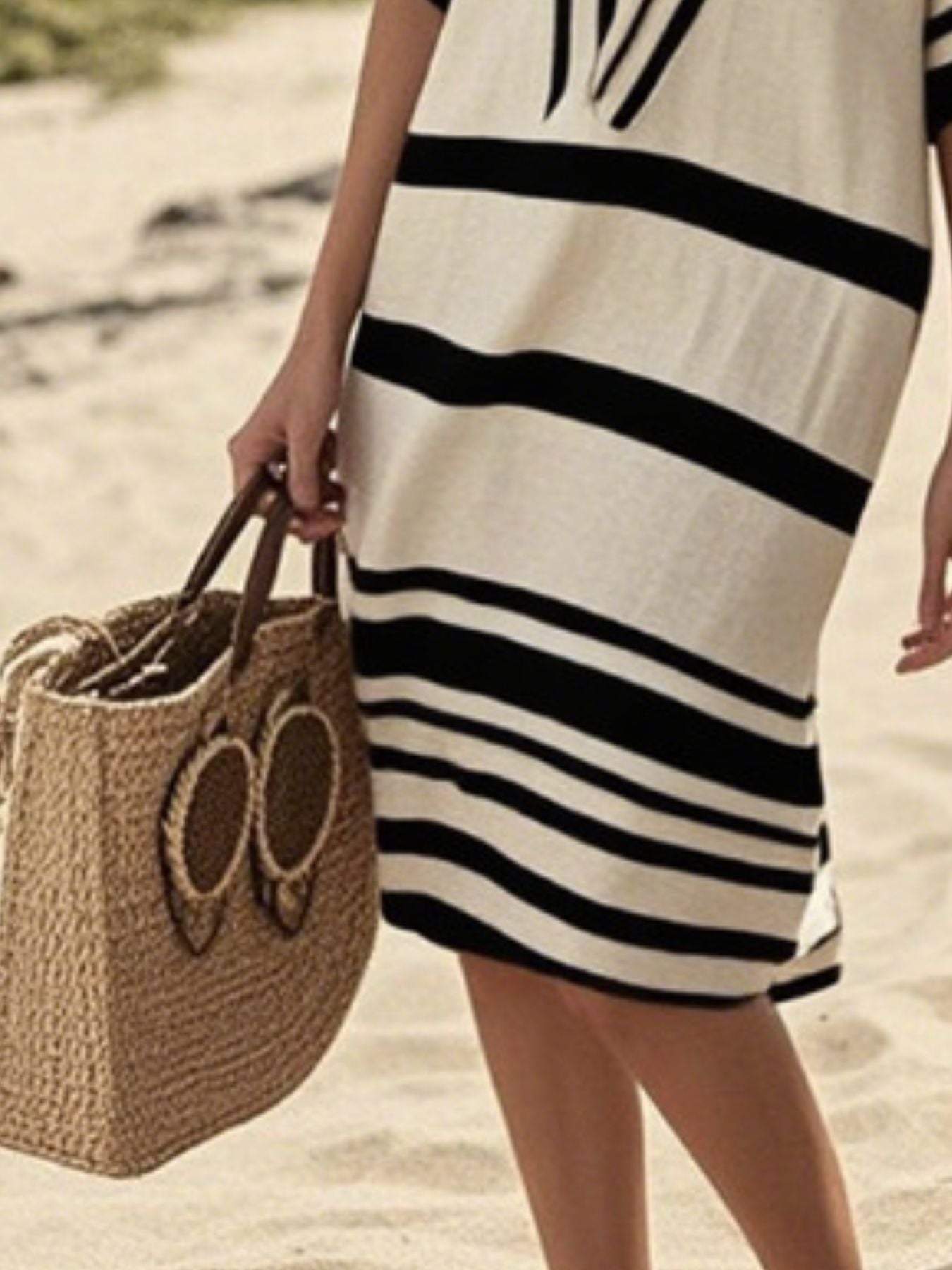 Plus size women's striped half-sleeve midi dress from Trendsi, featuring casual chic style and comfortable everyday wear.