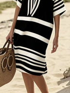 Plus size women's striped half-sleeve midi dress by Trendsi, casual chic everyday wear, featuring a stylish striped pattern.