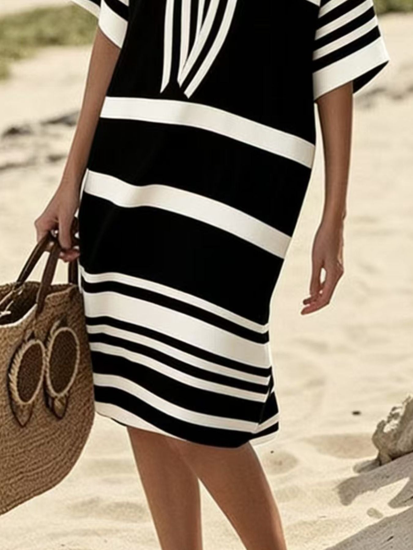 Plus size women's striped half-sleeve midi dress by Trendsi, casual chic everyday wear, featuring a stylish striped pattern.