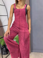 Full size wide leg denim overalls by Trendsi, featuring a one-piece design with adjustable straps and a relaxed fit.