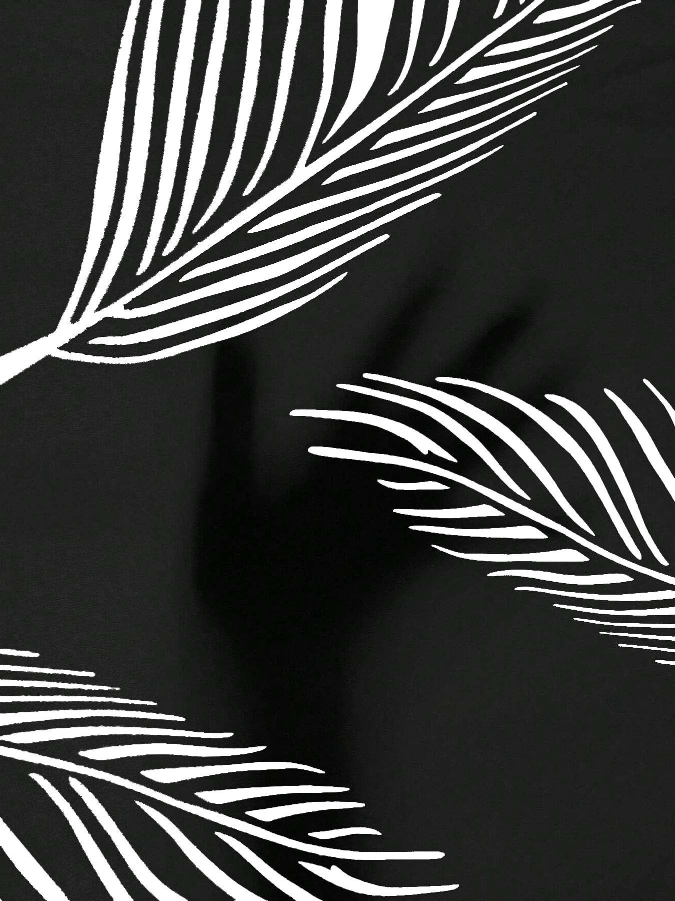 Close-up of black fabric with white, minimalist line-drawn palm leaf patterns.