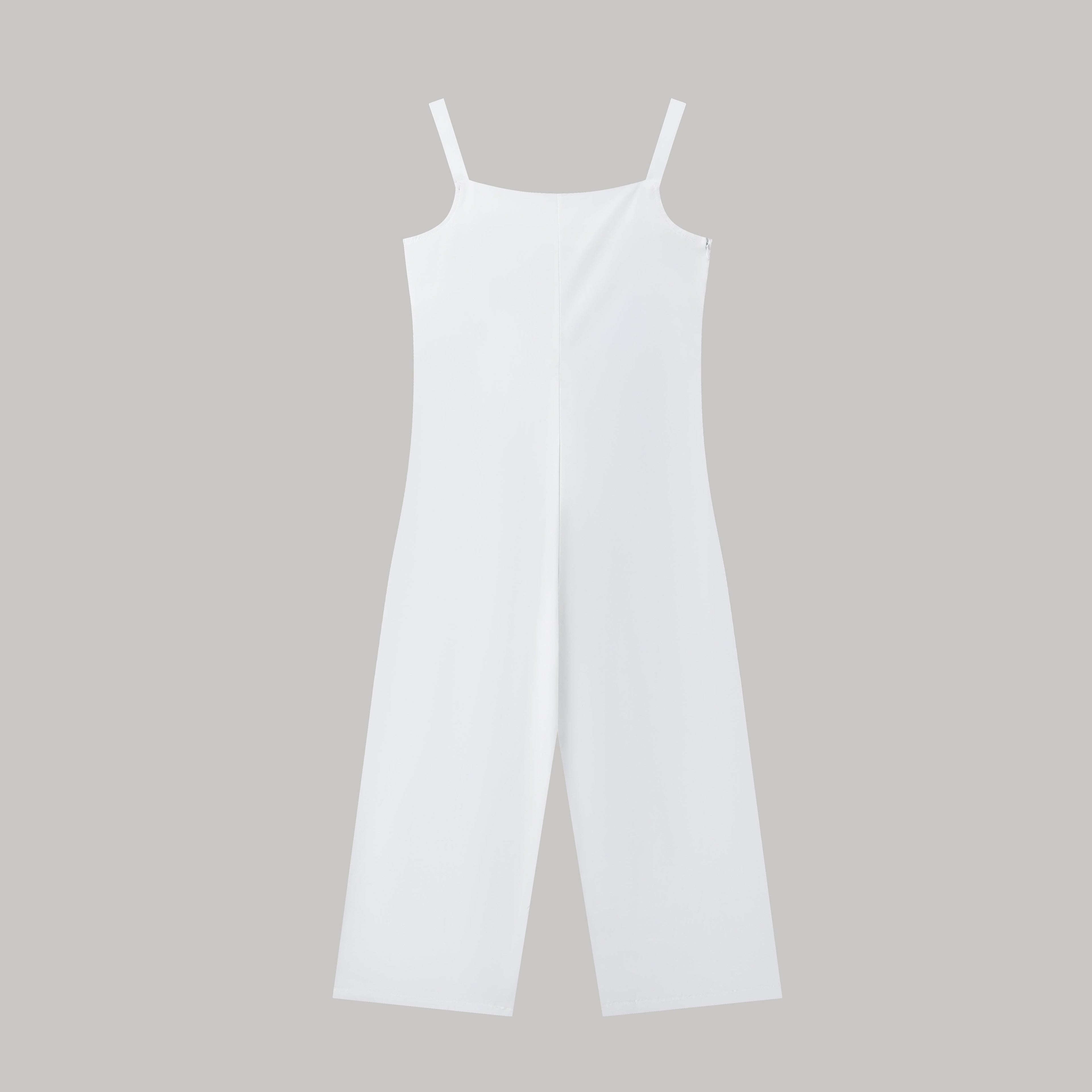 Minimalist white spaghetti strap jumpsuit with a wide-leg silhouette against a plain grey background.