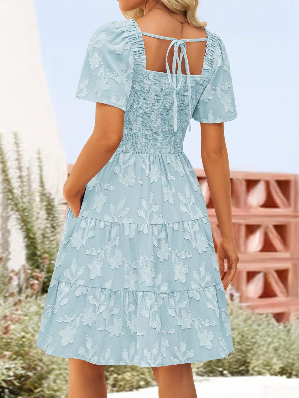 Women's smocked tiered square neck short sleeve casual dress with pockets by Trendsi, featuring a feminine neckline and lightweight fabric.