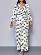Women's polka dot long sleeve jumpsuit with wide legs and pockets, featuring a stylish and comfortable design from Trendsi.