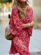 Paisley print balloon sleeve mini dress by Trendsi, stylish boho party dress with flowy silhouette and vibrant pattern.