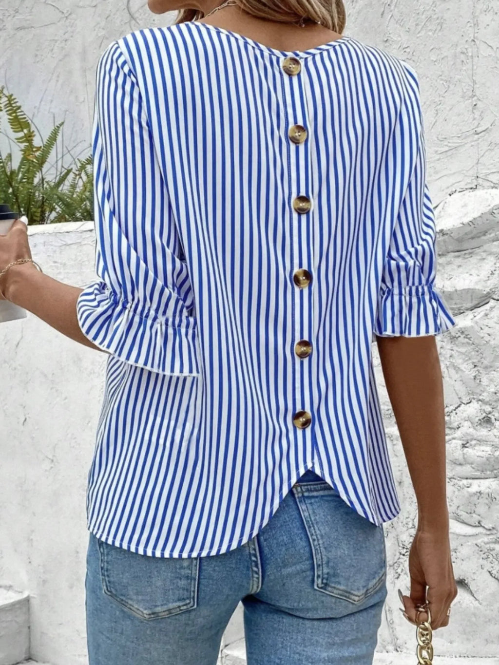 Women's striped ruffled round neck half sleeve blouse from Trendsi, featuring a stylish design and comfortable fit.
