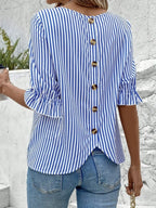 Women's striped ruffled round neck half sleeve blouse from Trendsi, featuring a stylish design and comfortable fit.