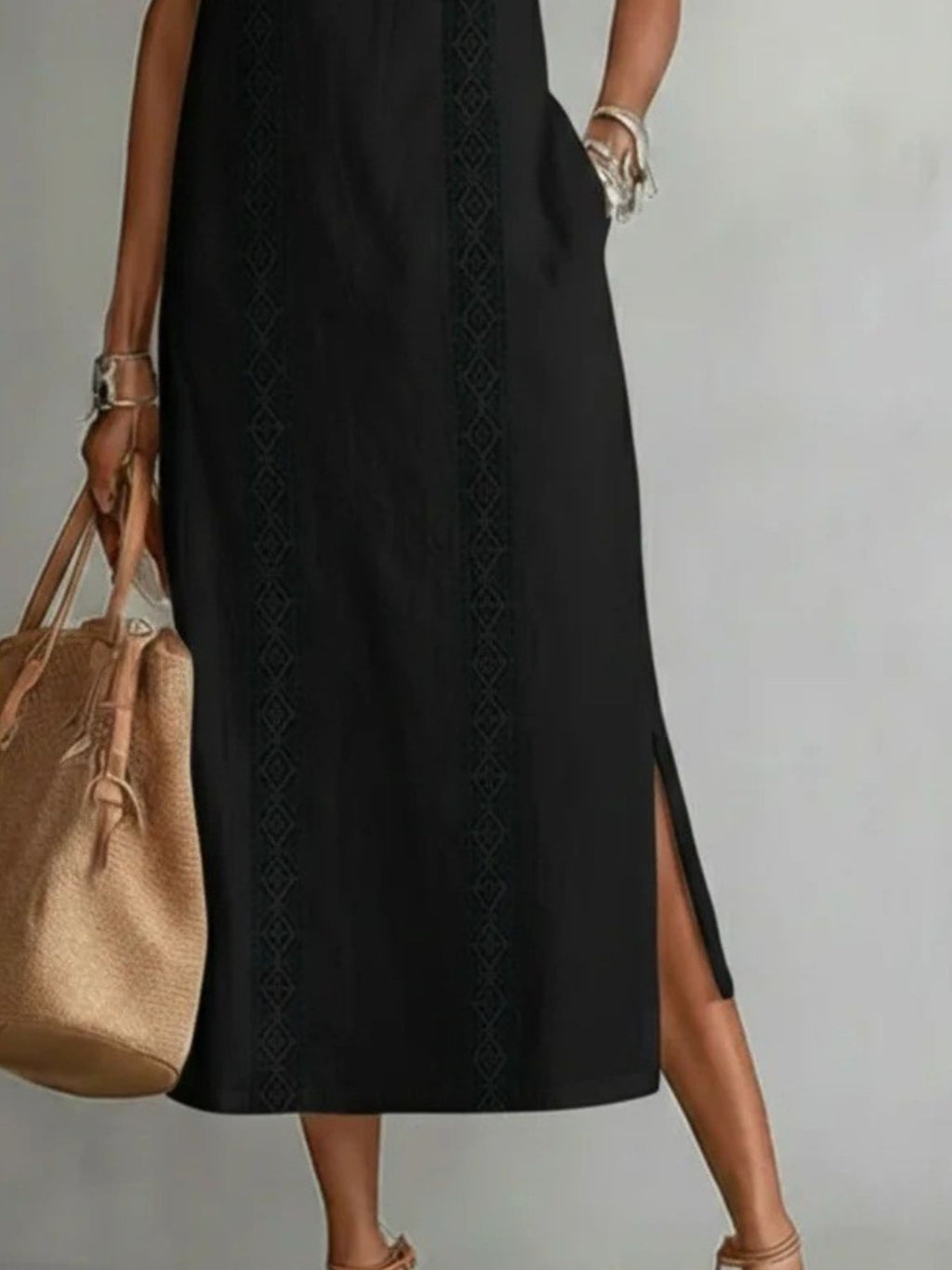 Sleeveless hollow-out midi dress with side slit and pockets, trendy fashion dress from Trendsi, shown in a stylish casual look.