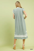 Mint green linen-cotton blend midi dress with geometric trim from Trendsi, showcasing a flowy silhouette and stylish design.