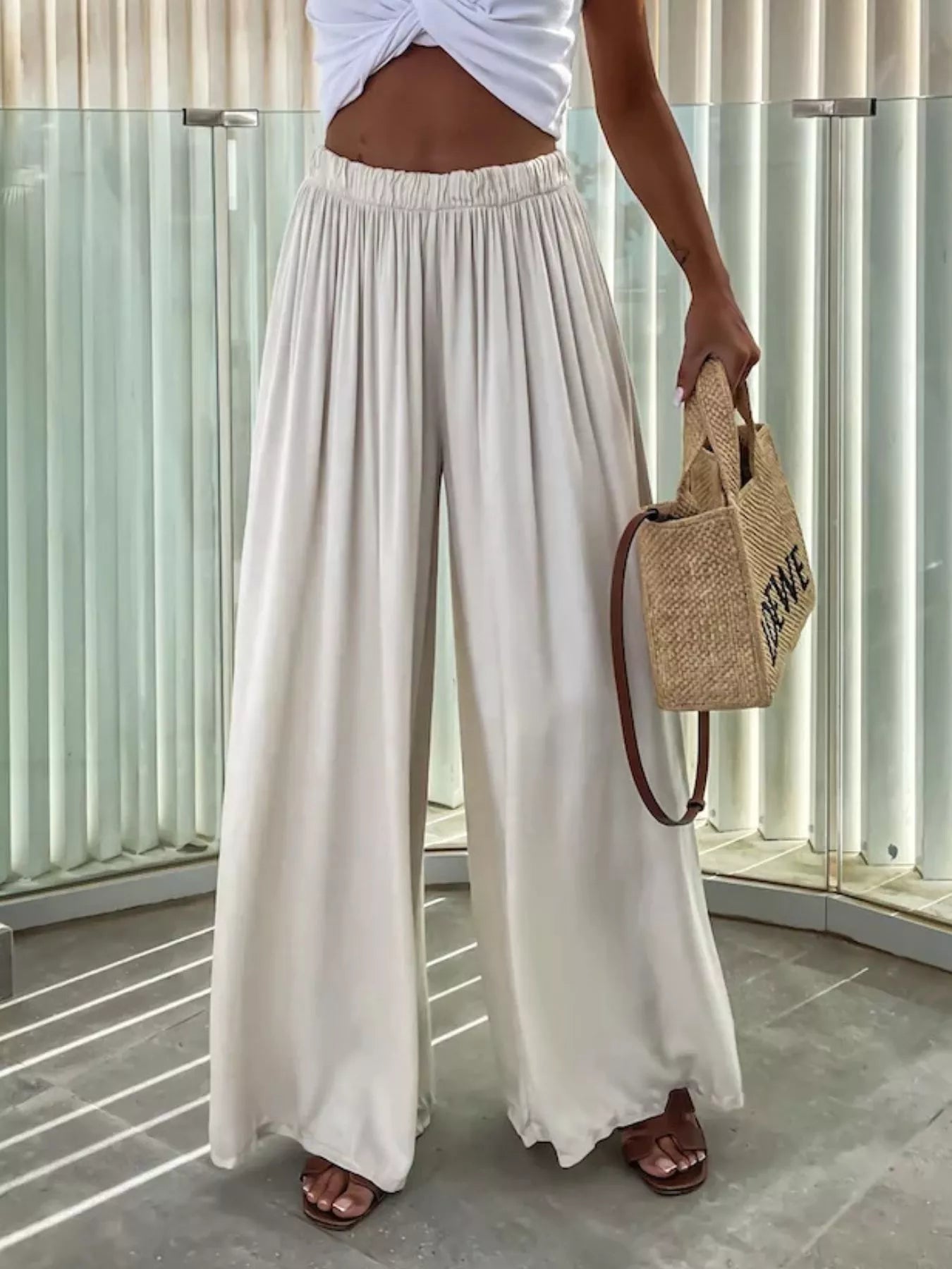 Wide-leg flowy pants from Trendsi, lightweight and relaxed fit, shown in a natural drape with a comfortable waistband.