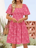 Women's smocked tiered square neck short sleeve casual dress with pockets, trendy and comfortable for everyday wear.