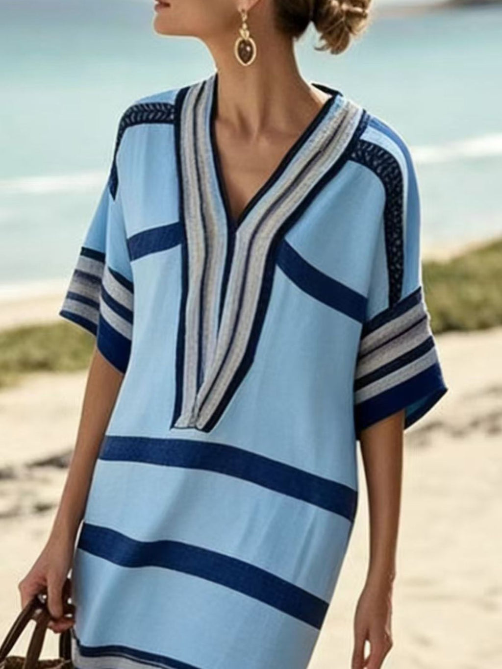Plus size women's striped midi dress with half-sleeves, casual chic style, featuring a relaxed fit and stylish pattern.