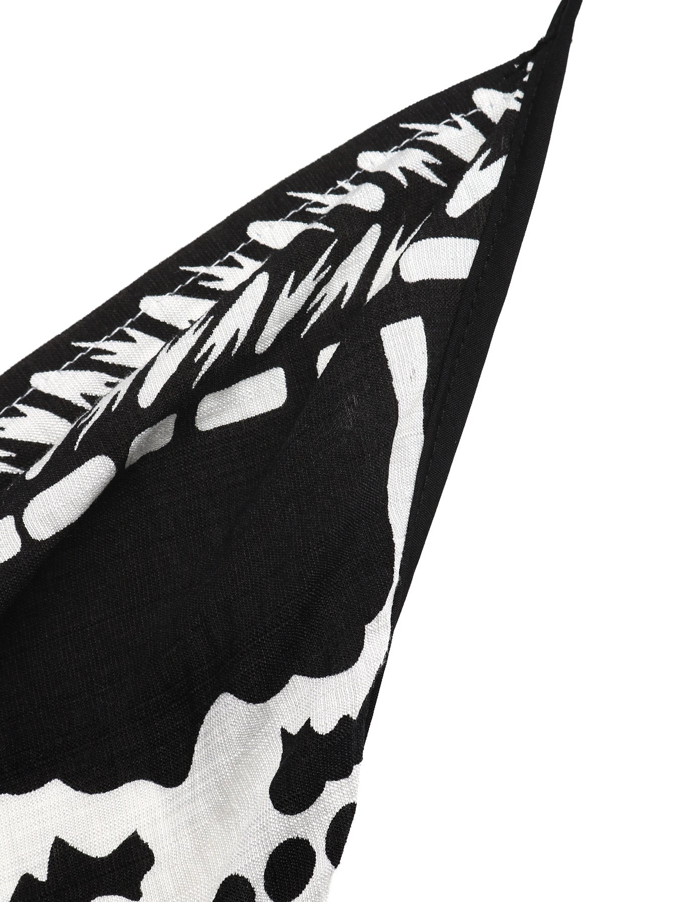 Women's printed halter neck maxi dress with tie-back detail, featuring a flowy silhouette and vibrant floral pattern.