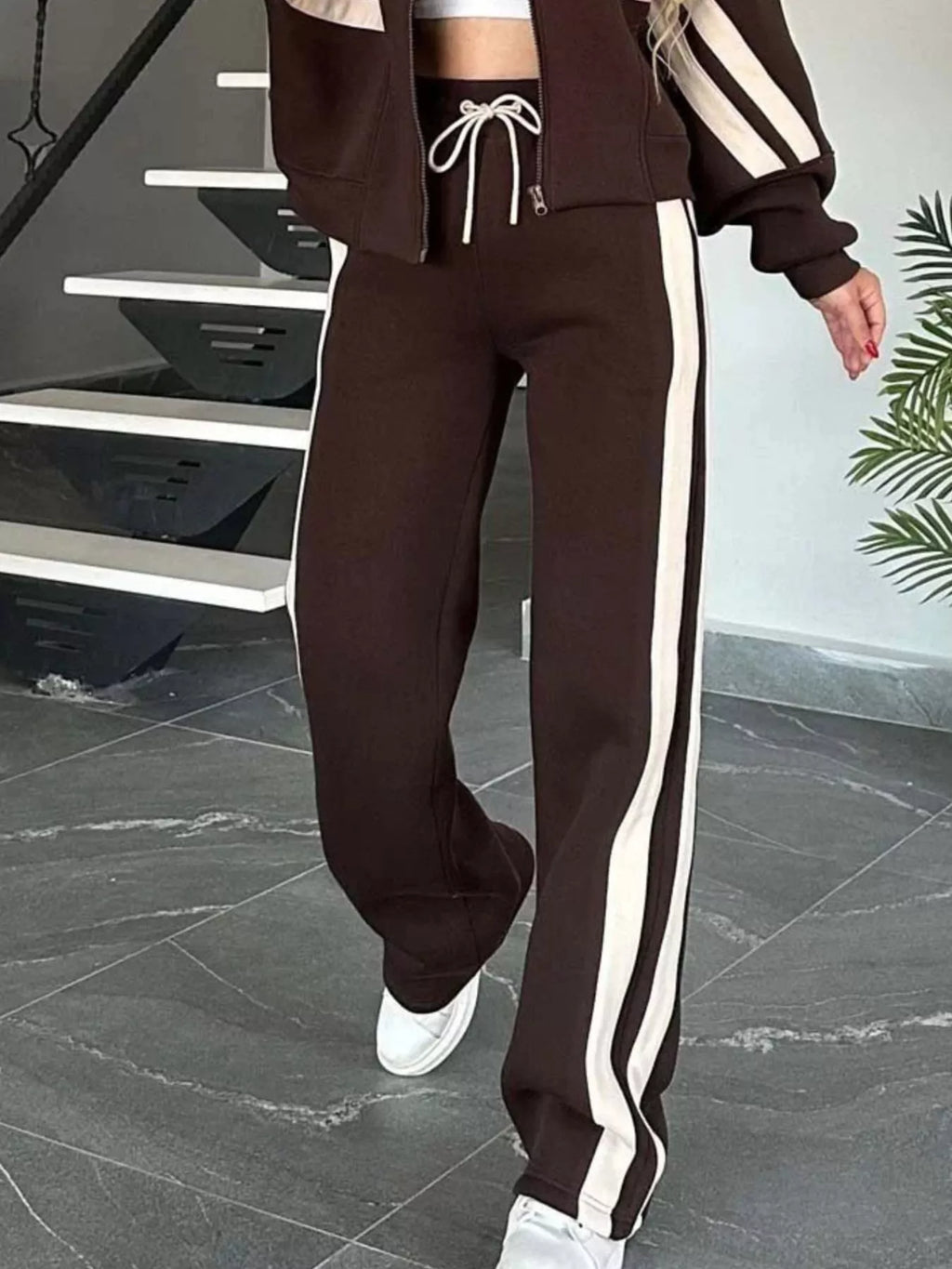 Plus size contrast stripe zip-up activewear jacket and pants set by Plush Fashion Hub, featuring bold stripes and full-length design.