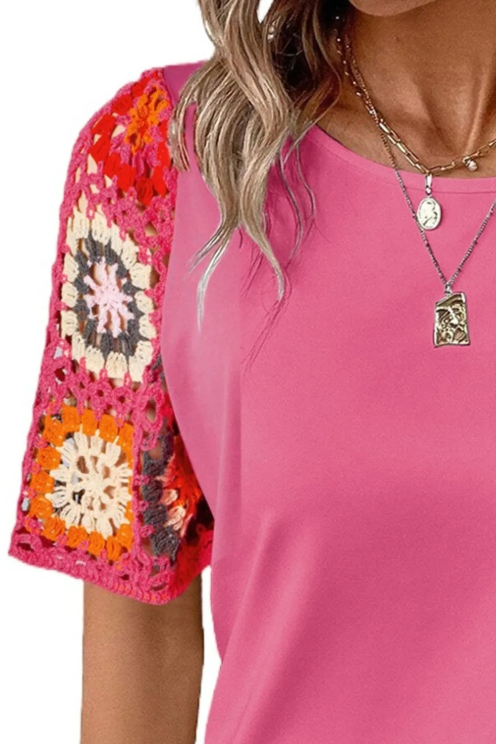 Geometric print round neck short sleeve blouse from Trendsi, featuring a stylish design and comfortable fit.