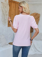 White eyelet asymmetrical neck short sleeve T-shirt from Trendsi featuring a stylish neckline and casual top design.