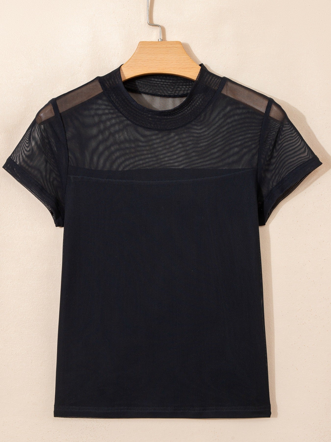 Women's sheer mesh patchwork cap sleeve T-shirt by Trendsi, featuring elegant layering design and stylish cut.
