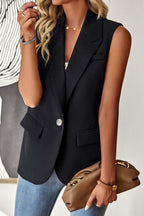 Woman wearing a sleeveless black tailored blazer with a single-button closure, notched lapels, and flap pockets.