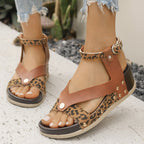 Women's leopard print ankle strap wedge sandals by Trendsi featuring comfortable summer footwear with stylish animal pattern design.