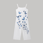 White wide-leg jumpsuit with thin straps and scattered blue butterfly print.