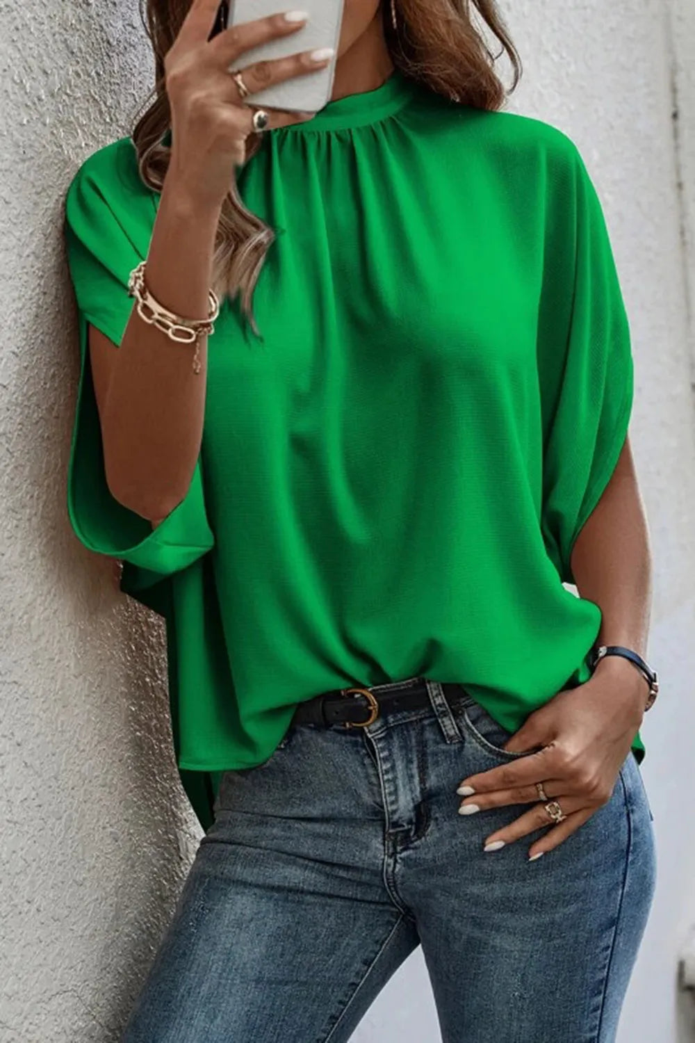 Elegant Trendsi women's tie-back half-sleeve blouse with side slit, showcasing a stylish and lightweight top design.