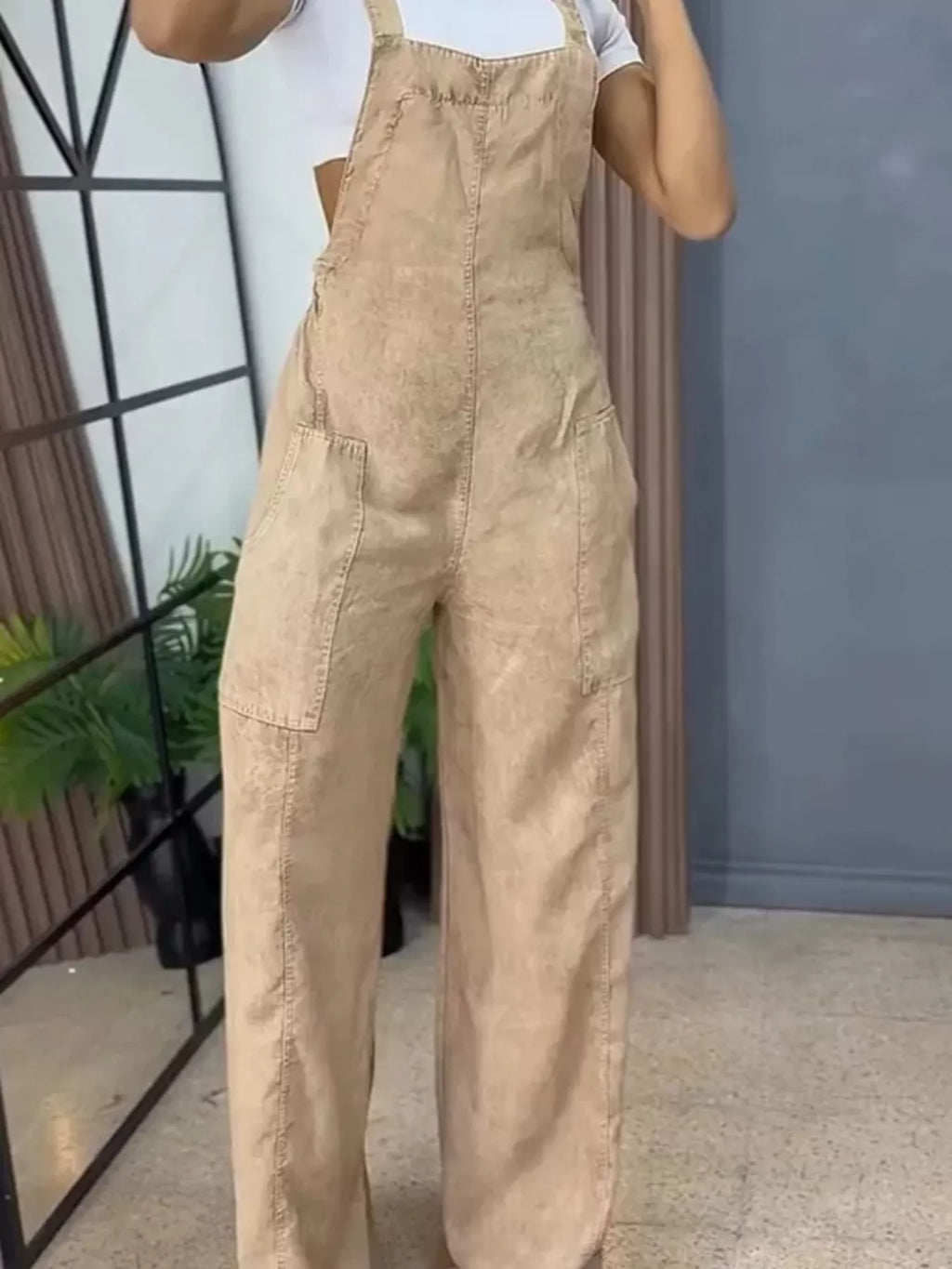 Full size wide leg denim overalls by Trendsi, featuring a one-piece design with adjustable straps and front pockets.