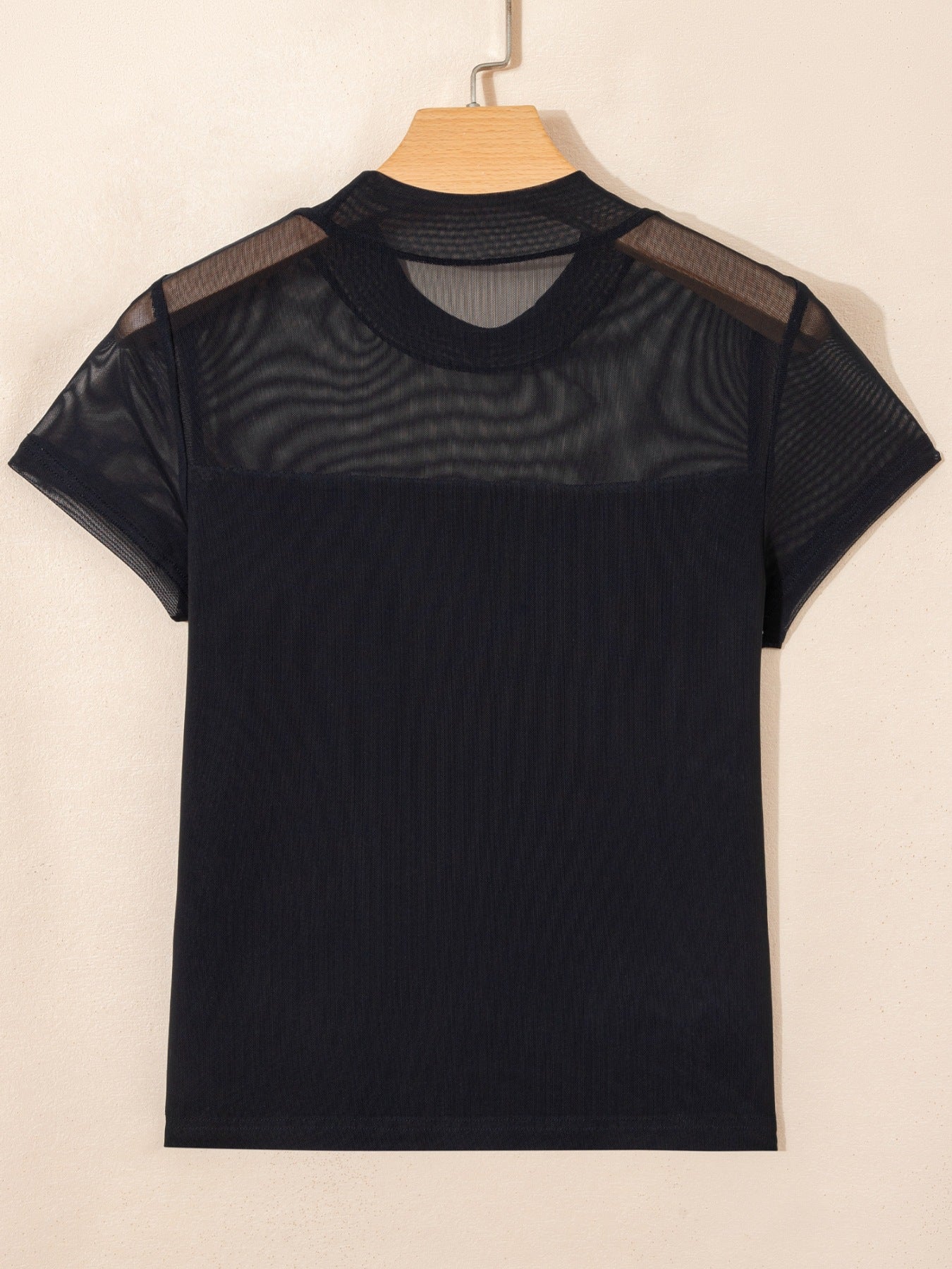 Women's sheer mesh patchwork cap sleeve T-shirt by Trendsi, featuring a stylish layered design and elegant lightweight fabric.