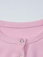 Women's ribbed knit button-front long sleeve T-shirt from Trendsi, featuring a fitted design and classic ribbed texture.