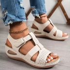 Open toe wedge sandals in neutral tones, trendy footwear by Trendsi featuring a comfortable wedge heel and stylish open toe design.