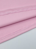 Women's ribbed knit button-front long sleeve T-shirt from Trendsi, shown in a close-up of the soft fabric and stylish design.