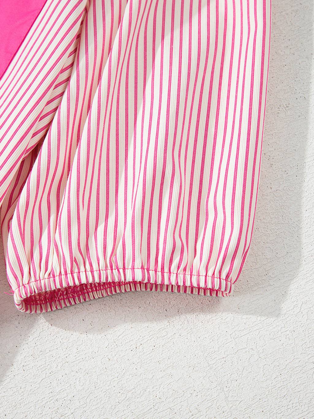 Stripe color block puff sleeve button-down mini dress by Trendsi featuring vibrant stripes and a fitted silhouette.