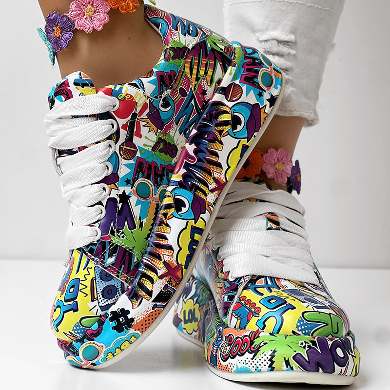 Colorful lace-up sneakers with a vibrant comic book graffiti print and chunky white soles.
