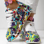 Colorful lace-up sneakers with a vibrant comic book graffiti print and chunky white soles.