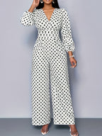 Women's polka dot long sleeve jumpsuit with wide legs and pockets, stylish Trendsi jumpsuit displayed on a model.