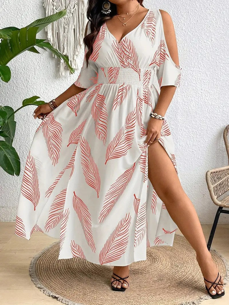 White cold-shoulder maxi dress with red feather pattern, v-neck, smocked waist, and high side slit.