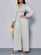 Women's polka dot long sleeve jumpsuit with wide legs and pockets, stylish and comfortable Trendsi jumpsuit on model.